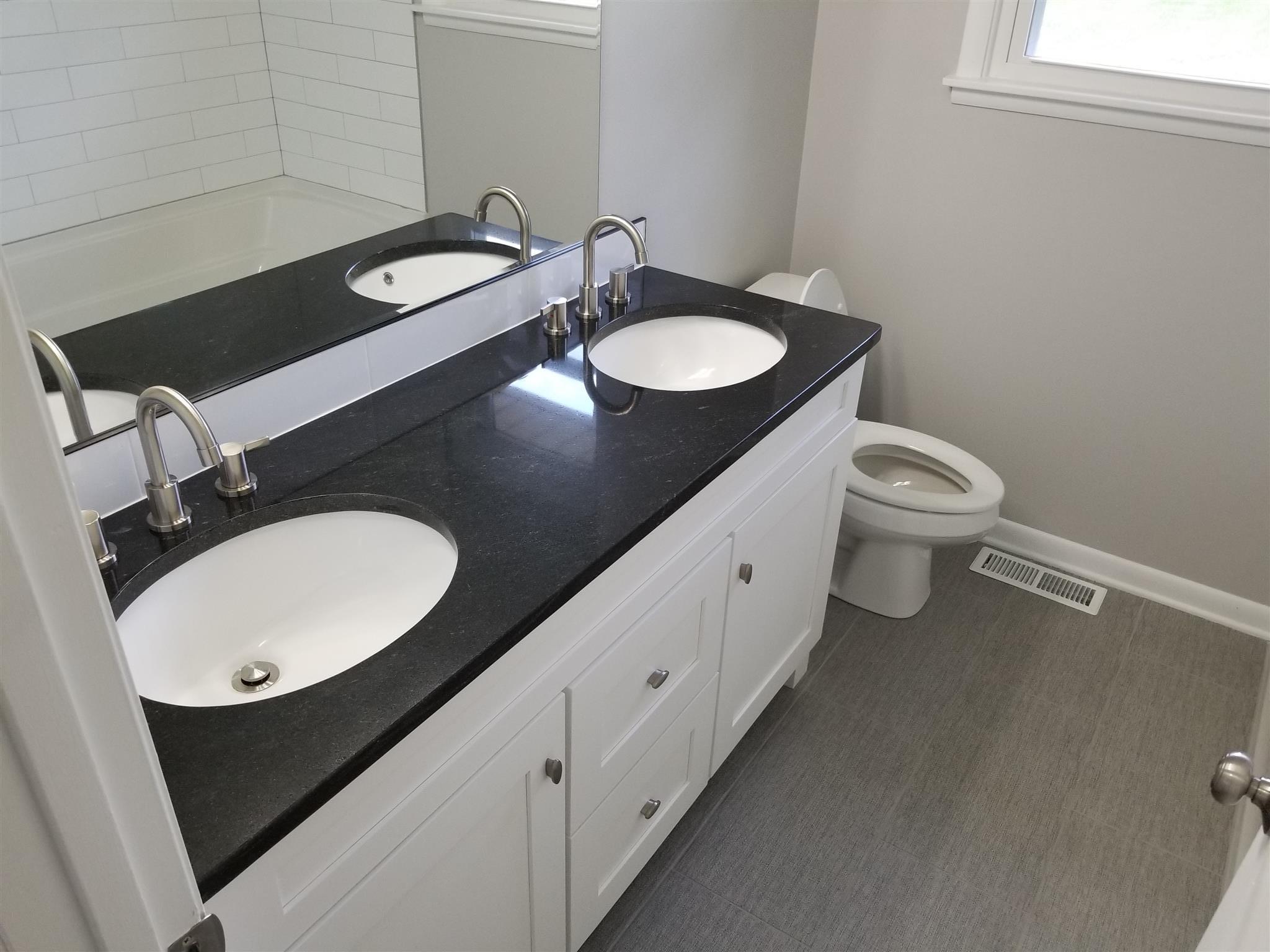 207 South Valley Road Hendersonville, TN 37075 - Photo 14 of 21 a bathroom with a granite countertop sink and a mirror