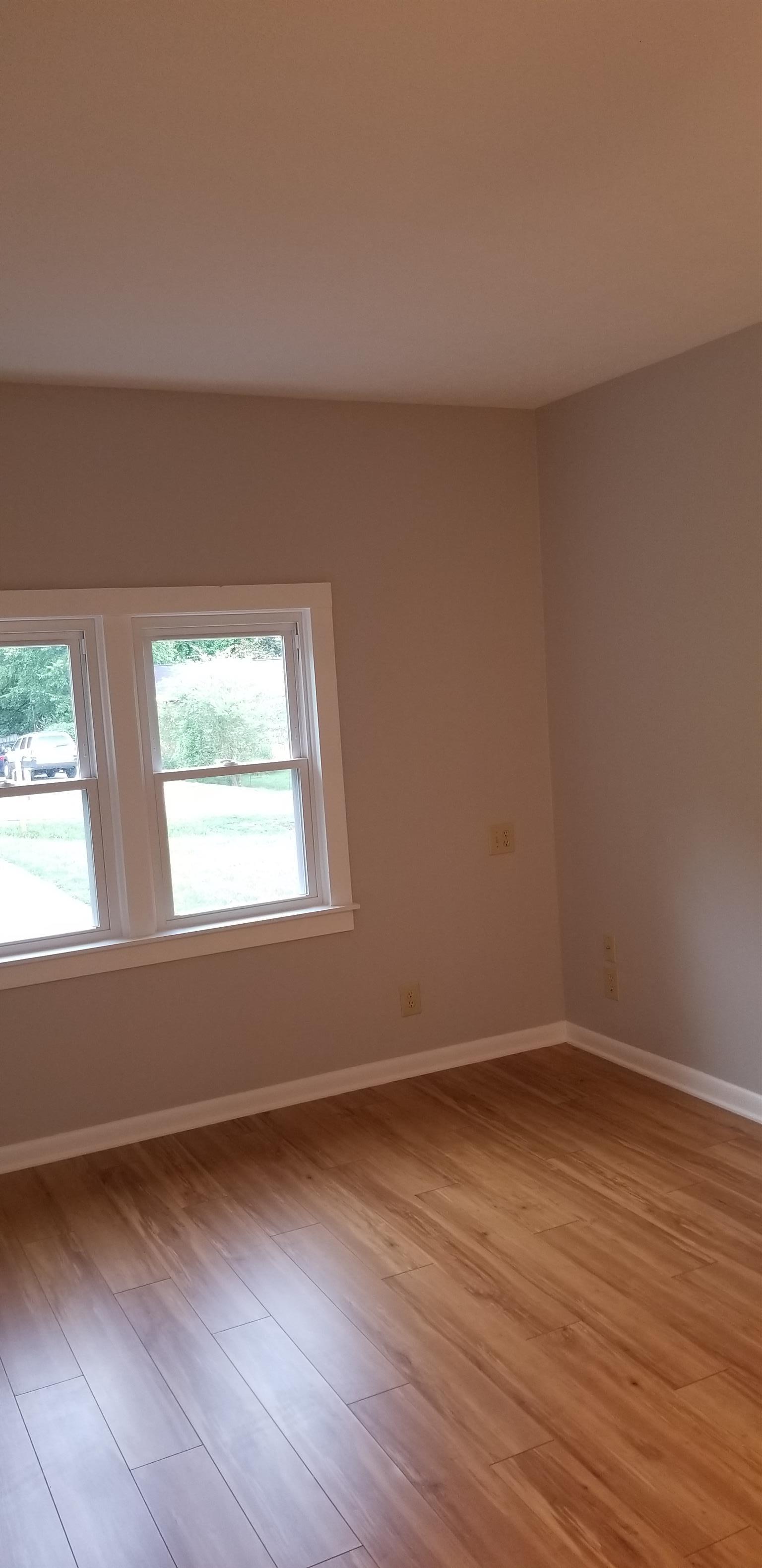 207 South Valley Road Hendersonville, TN 37075 - Photo 16 of 21 a view of an empty room with wooden floor and a window