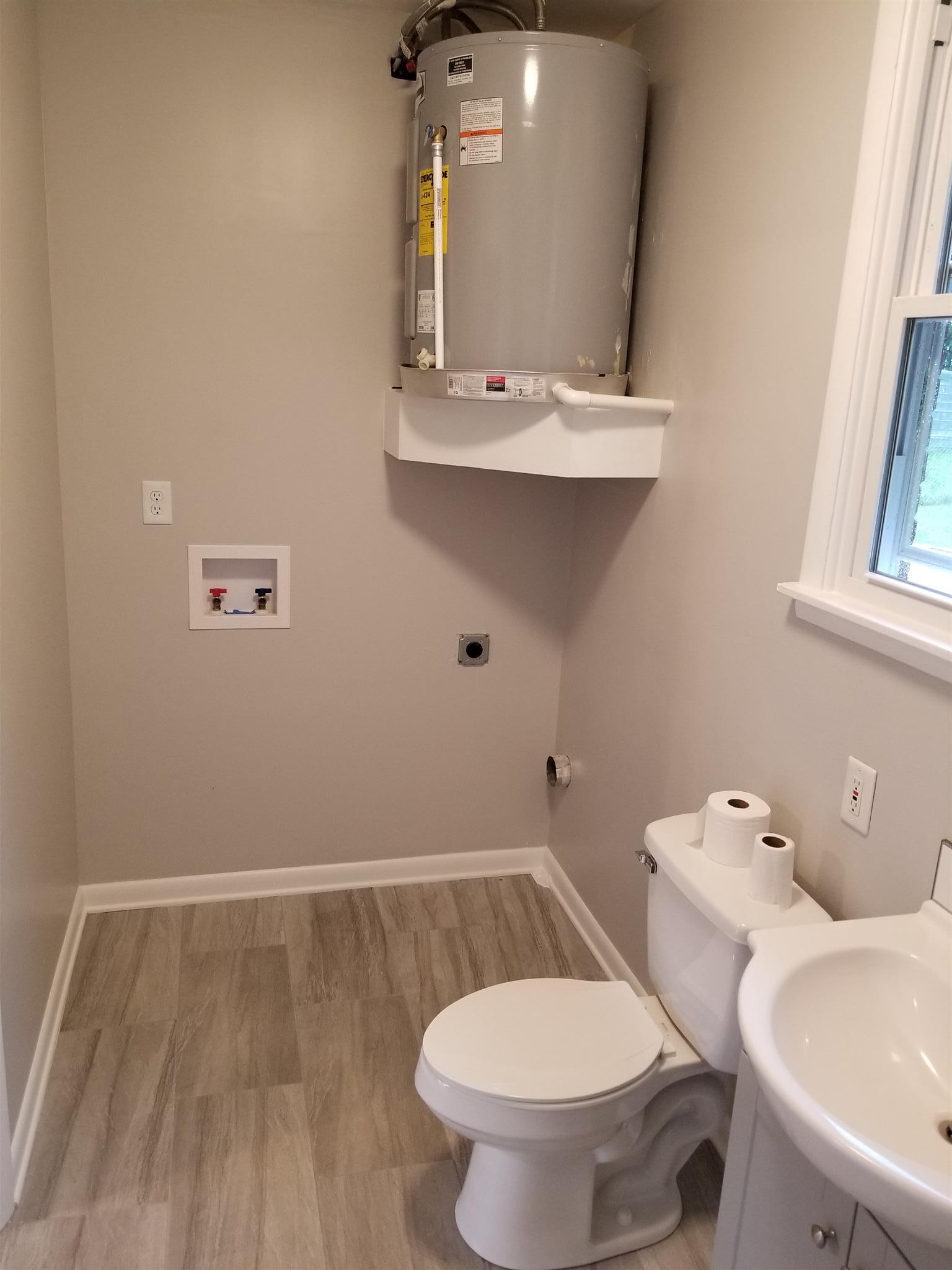 207 South Valley Road Hendersonville, TN 37075 - Photo 19 of 21 a bathroom with a toilet sink and mirror