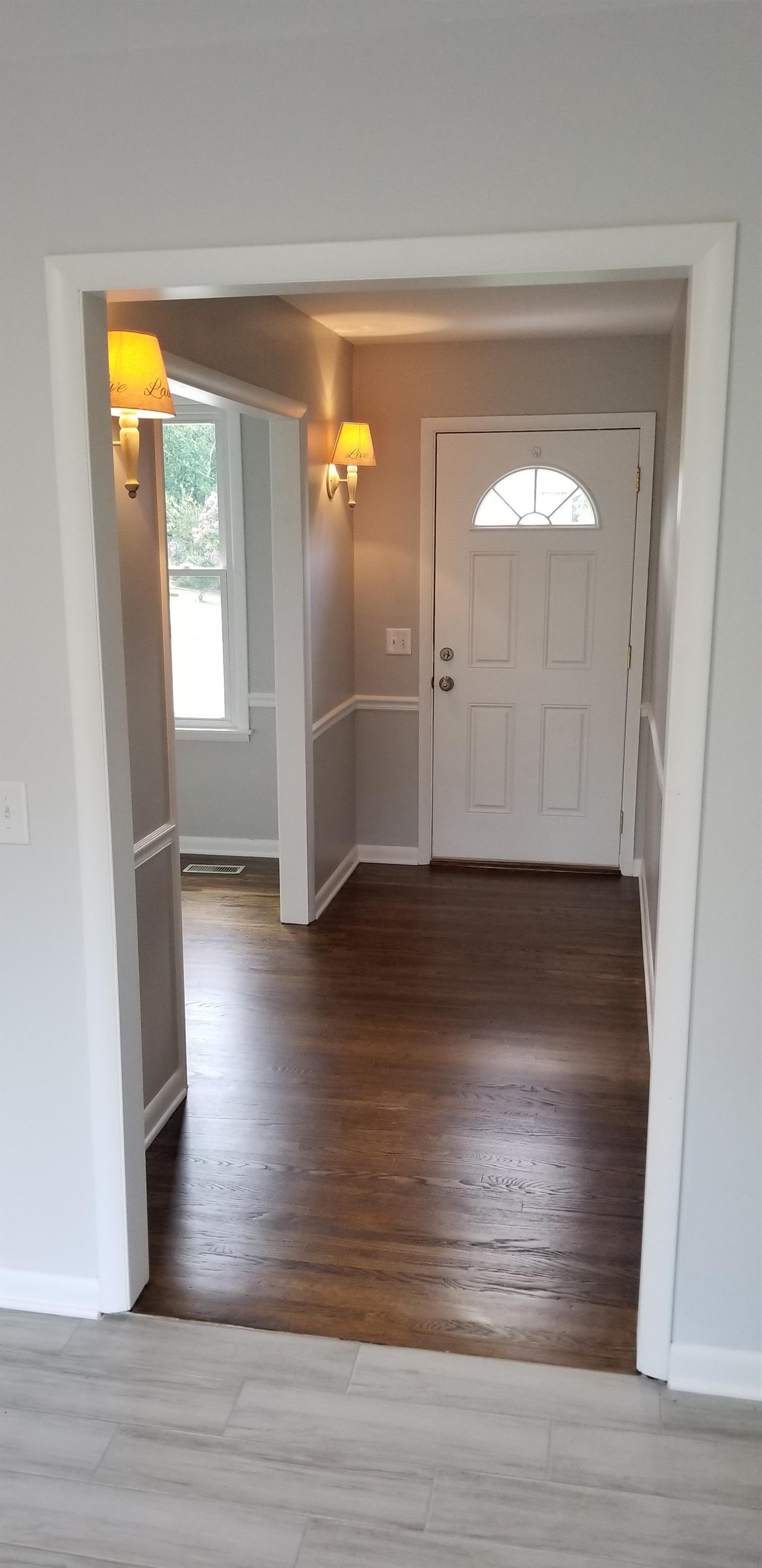 207 South Valley Road Hendersonville, TN 37075 - Photo 3 of 21 an empty room with wooden floor and entrance