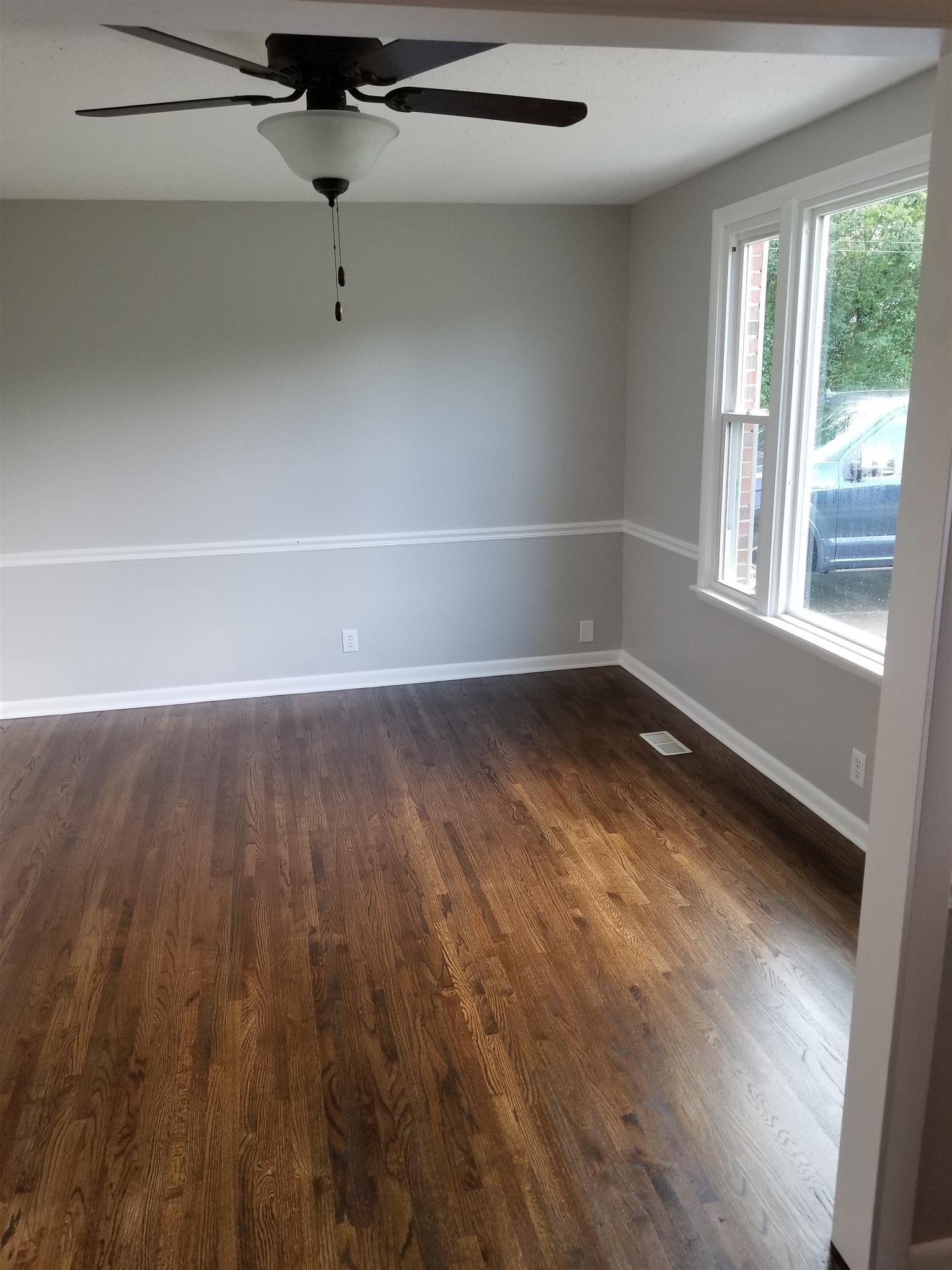 207 South Valley Road Hendersonville, TN 37075 - Photo 4 of 21 a view of a room with wooden floor and windows