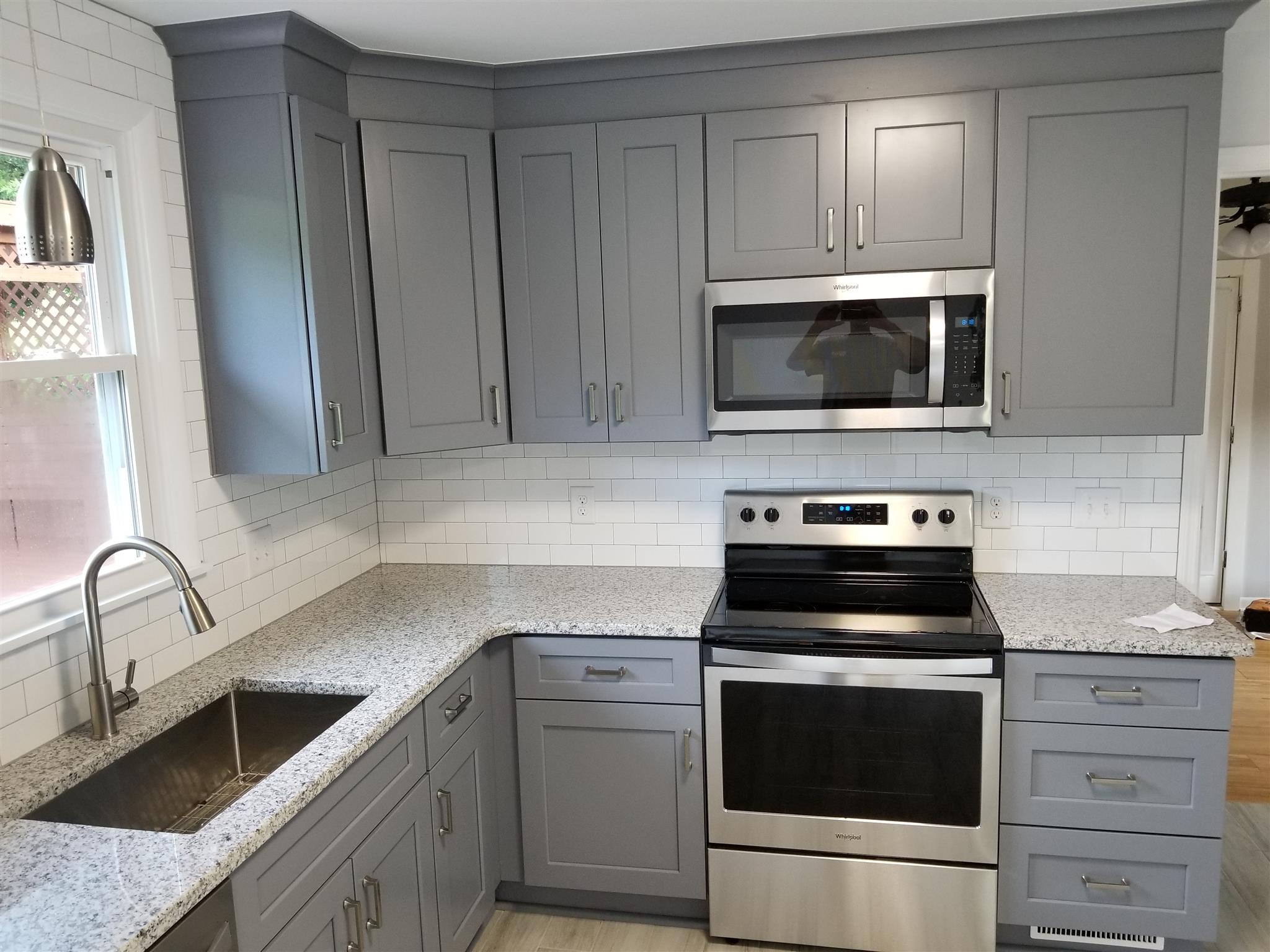 207 South Valley Road Hendersonville, TN 37075 - Photo 7 of 21 a kitchen with white cabinets stainless steel appliances and sink