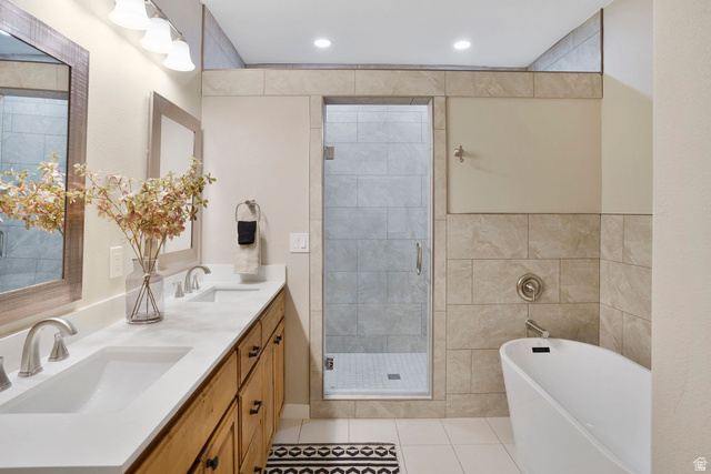 1570 South Rio Virgin Drive Washington, UT 84780 - Photo 32 of 71 Full bath with a soaking tub, a shower stall, double vanity, light tile patterned floors, and recessed lighting