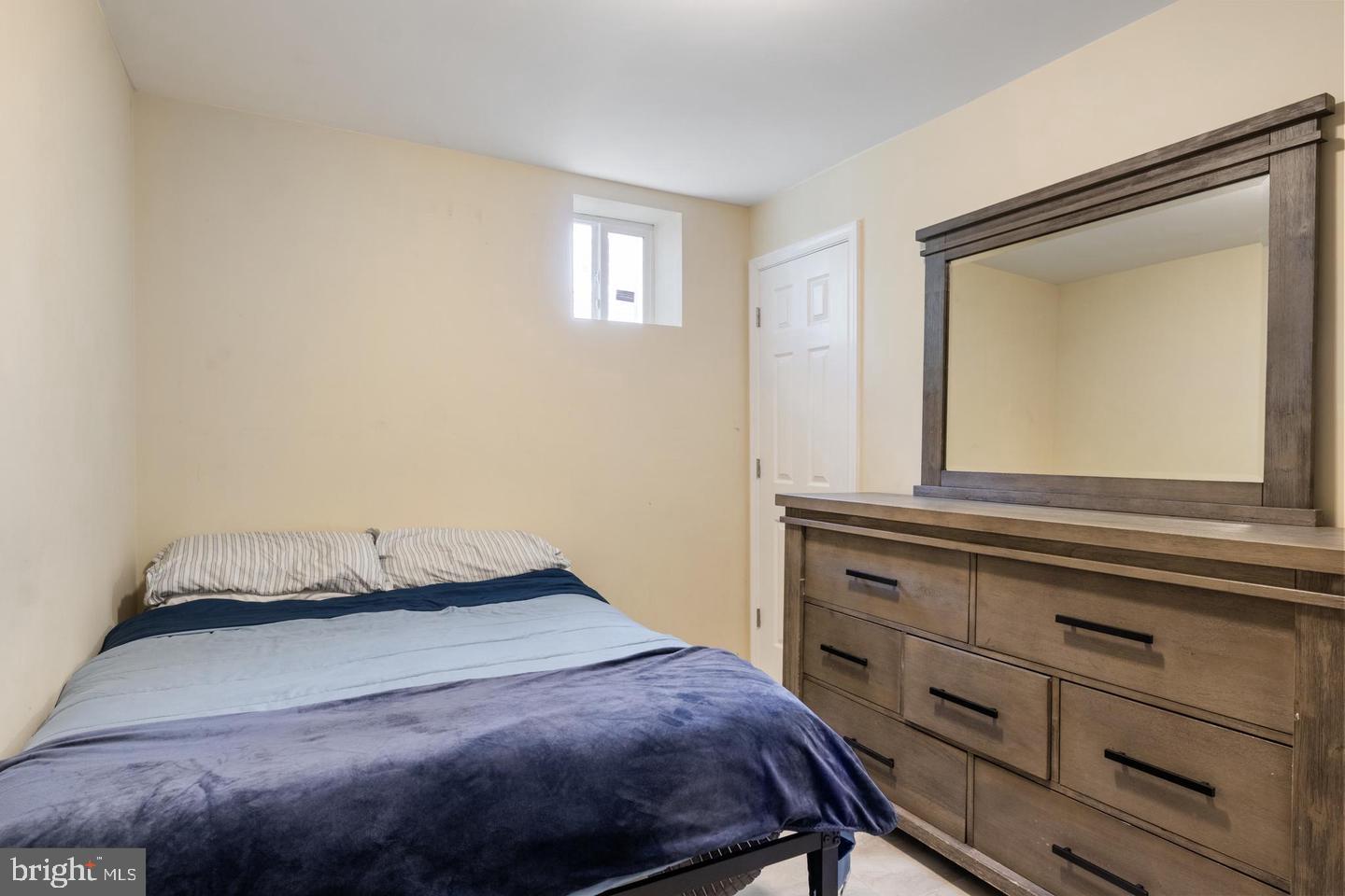 2808 East Northern Parkway Baltimore, MD 21214 - Photo 14 of 17 a bedroom with a bed and a window