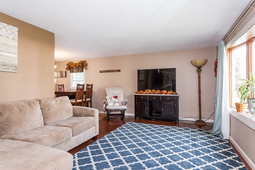 218 Ellendale Circle Springfield, MA 01128 - Photo 3 of 27 a living room with furniture and a flat screen tv