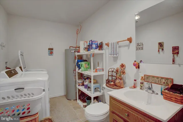 a living room with lots of furniture and a flat screen tv