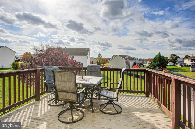 a view of a balcony with furniture