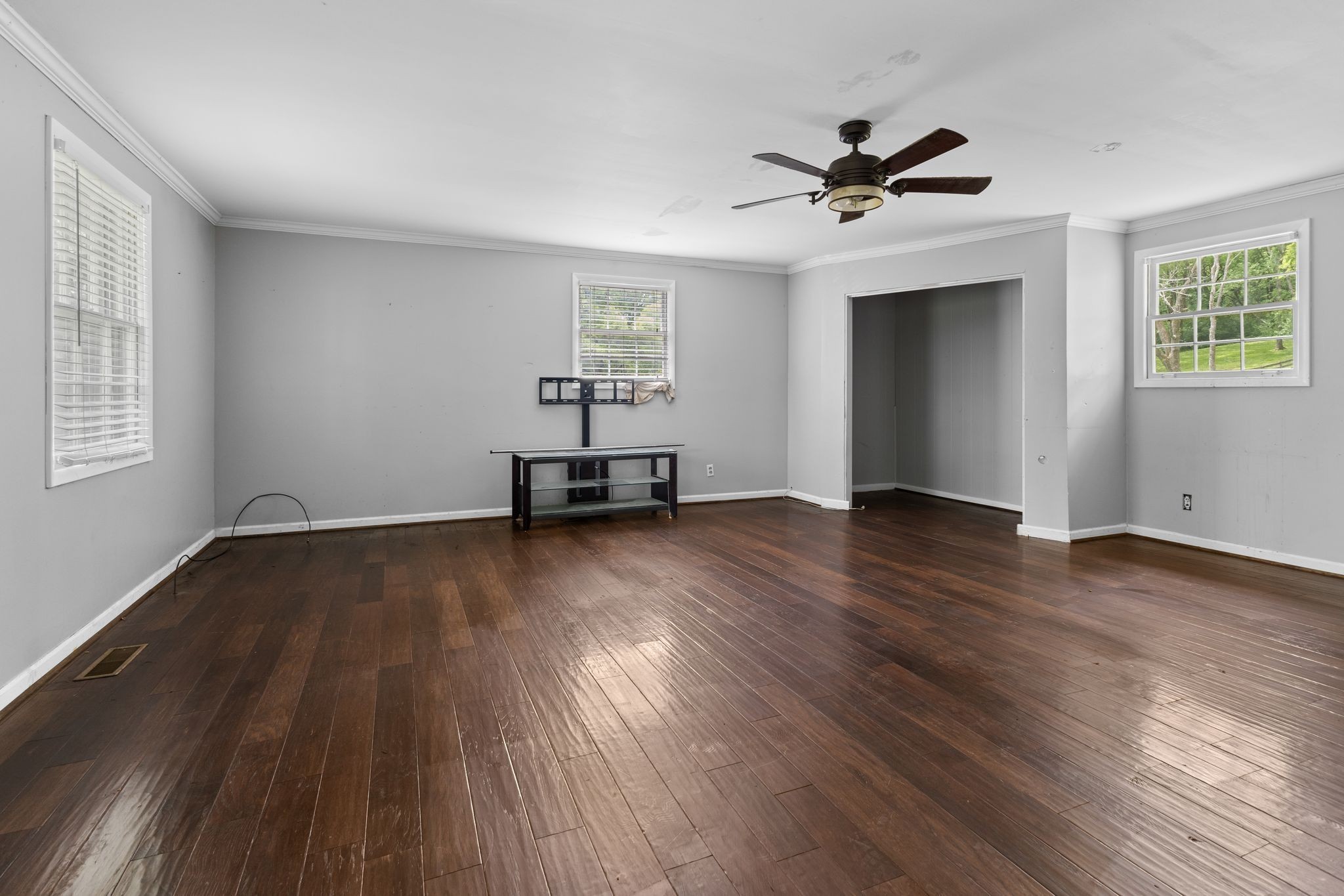 483 Franklin Road Franklin, TN 37069 - Photo 27 of 48 a view of a livingroom with wooden floor and a ceiling fan