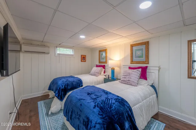 a bedroom with two beds and a window