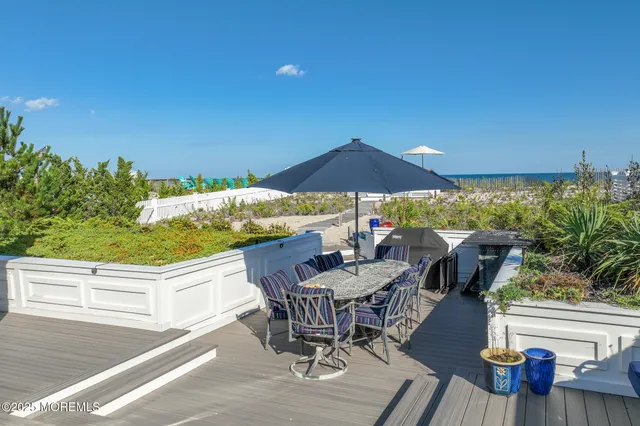 a view of an outdoor sitting area with furniture