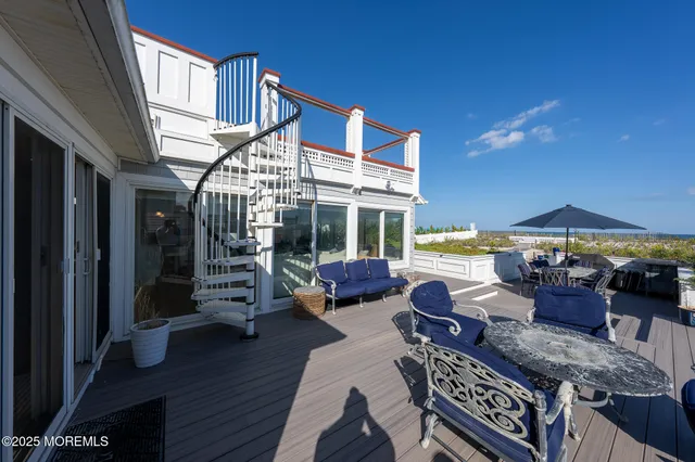 a outdoor space with patio lots of furniture and wooden floor