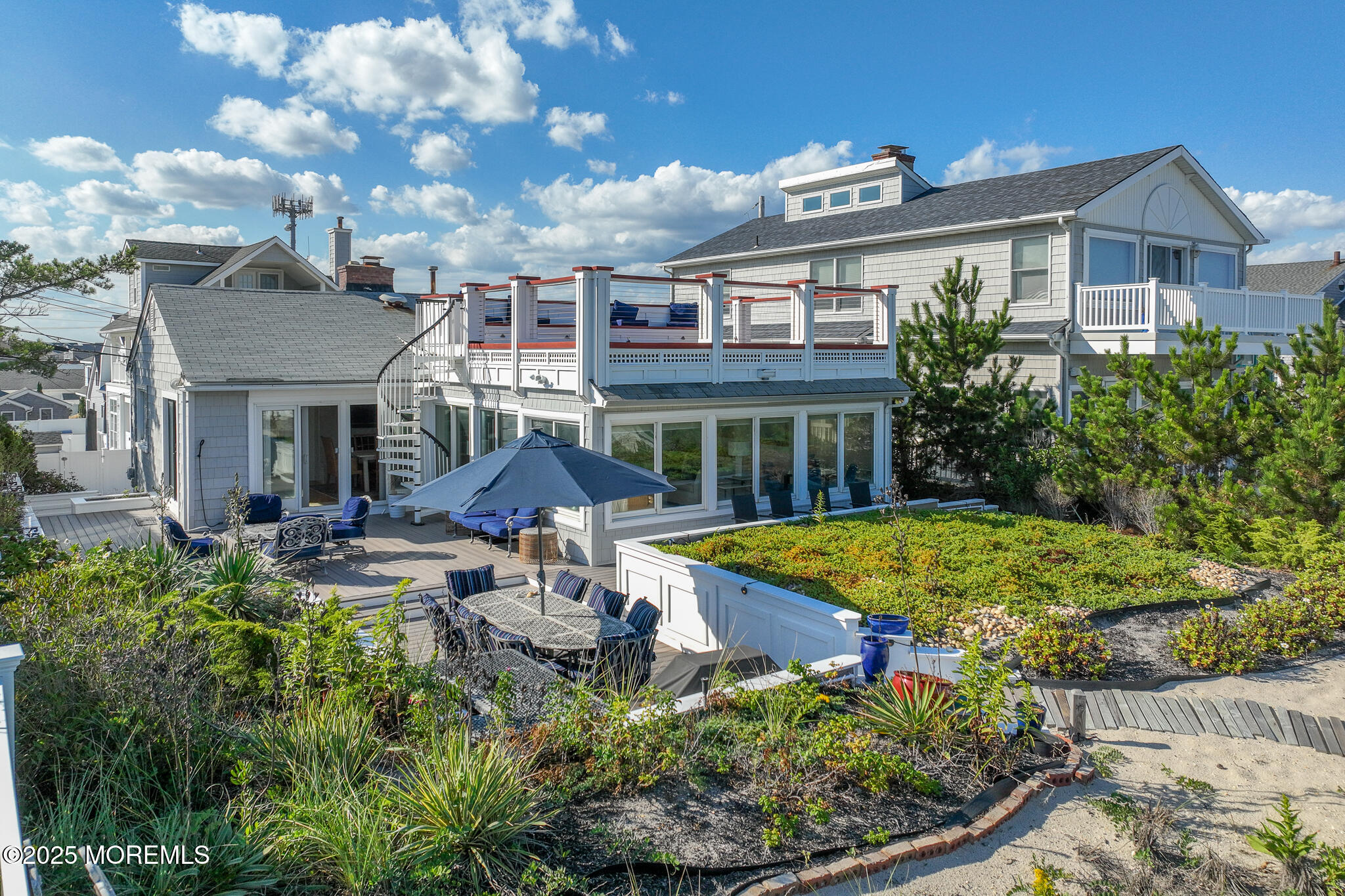 14 Falls Road Mantoloking, NJ 08738 - Photo 32 of 40 a view of a house with swimming pool and sitting area