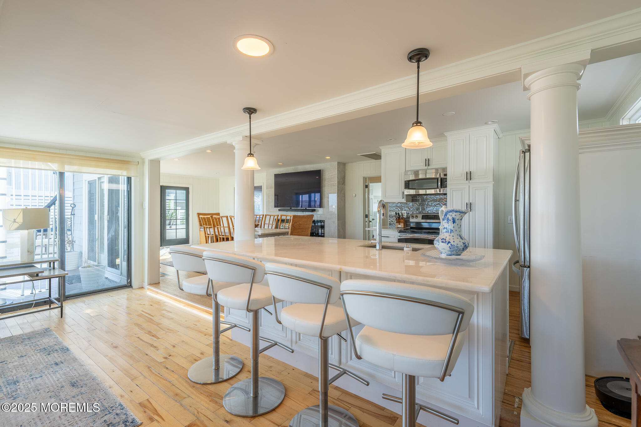 14 Falls Road Mantoloking, NJ 08738 - Photo 7 of 40 a view of a dining room and livingroom with furniture wooden floor a chandelier