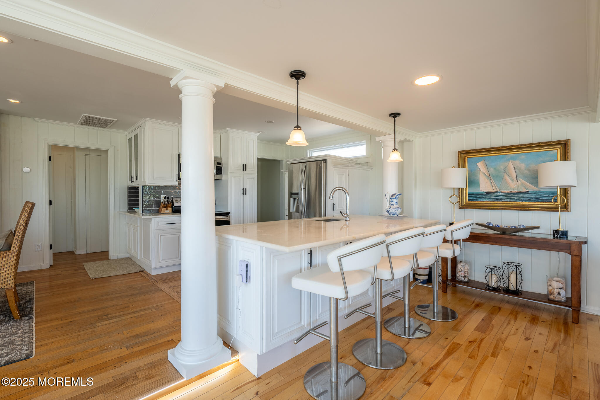 14 Falls Road Mantoloking, NJ 08738 - Photo 8 of 40 a dining hall with stainless steel appliances granite countertop furniture wooden floor and a view of kitchen