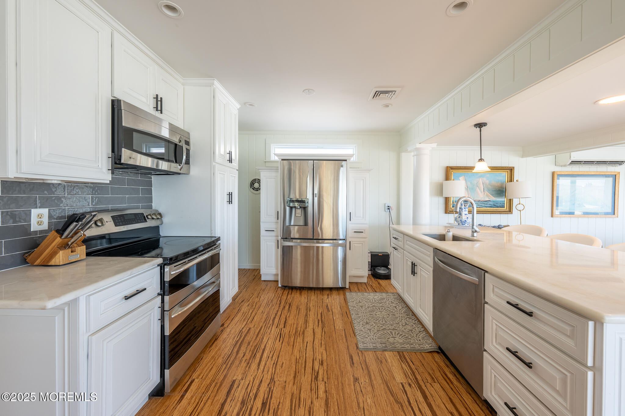 14 Falls Road Mantoloking, NJ 08738 - Photo 9 of 40 a kitchen with stainless steel appliances a stove sink microwave and cabinets
