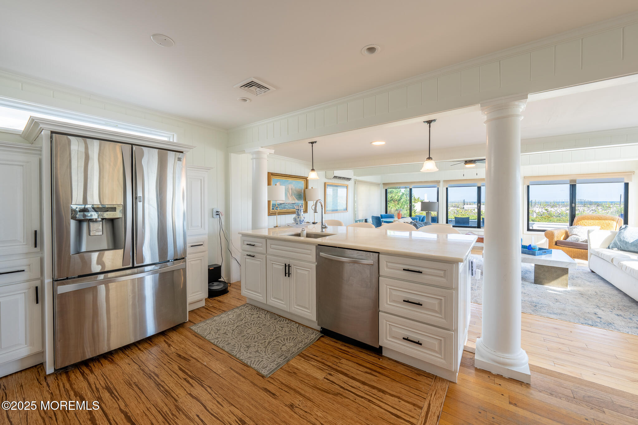 14 Falls Road Mantoloking, NJ 08738 - Photo 10 of 40 a kitchen with white cabinets and stainless steel appliances