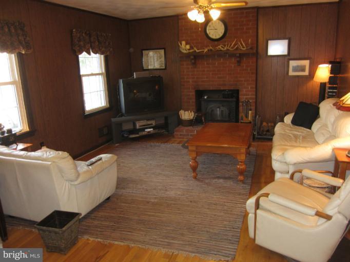 700 Pebblestone Court Silver Spring, MD 20905 - Photo 1 of 30 Large den with wood stove fireplace insert.