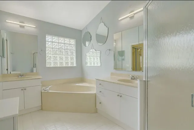 a bathroom with a glass shower door