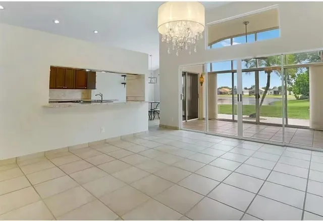 a spacious bathroom with a tub sink and mirror