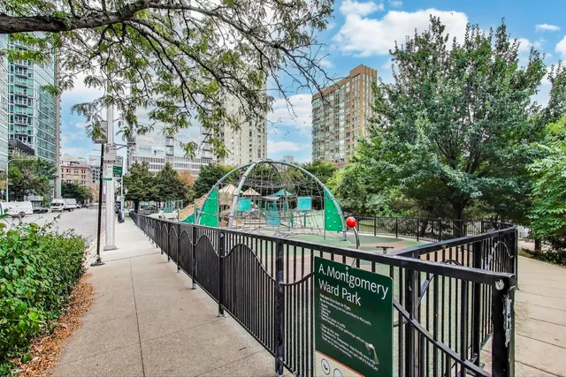 a balcony with tall trees in front of it