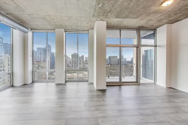 a view of an entryway with wooden floor