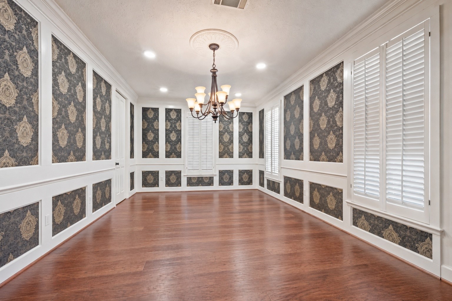 7639 Post Bridge Road Spring, TX 77389 - Photo 16 of 42 a view of an empty room with wooden floor and windows