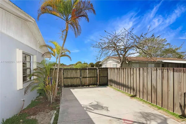 a view of a wrought iron fences in front of house