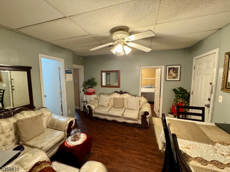57 East Main Street Paterson, NJ 07522 - Photo 11 of 20 a living room with furniture and a flat screen tv