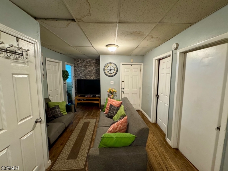 57 East Main Street Paterson, NJ 07522 - Photo 14 of 20 a living room with furniture and a flat screen tv