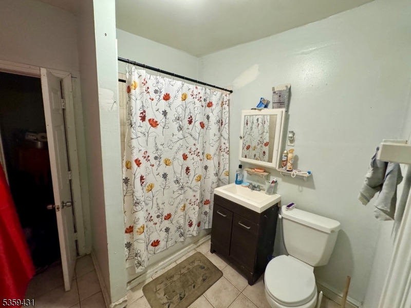 57 East Main Street Paterson, NJ 07522 - Photo 17 of 20 a bathroom with a sink toilet and shower