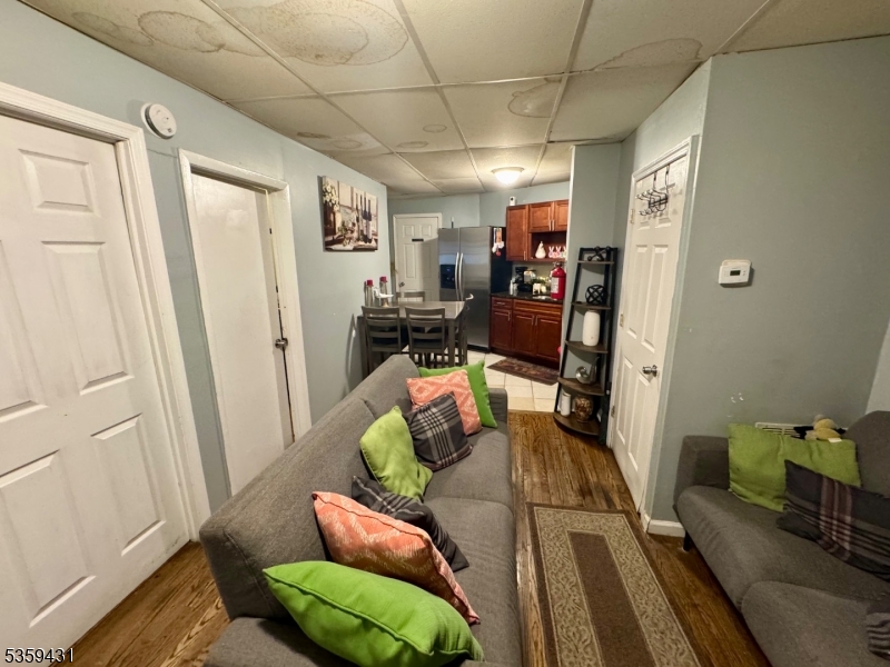 57 East Main Street Paterson, NJ 07522 - Photo 18 of 20 a living room with furniture and a couch