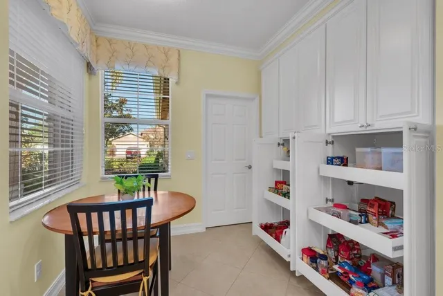 a reading room with furniture and a window