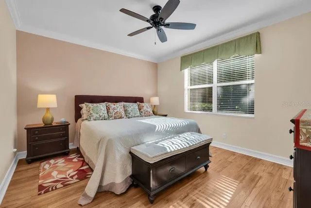 a bedroom with a bed and window