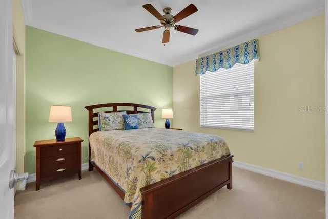 a bedroom with a bed and window