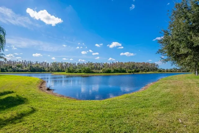 a view of a lake with a big yard