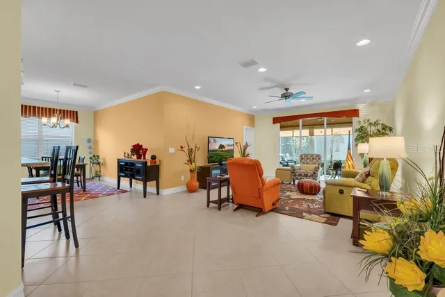 a bed room with furniture and a large window