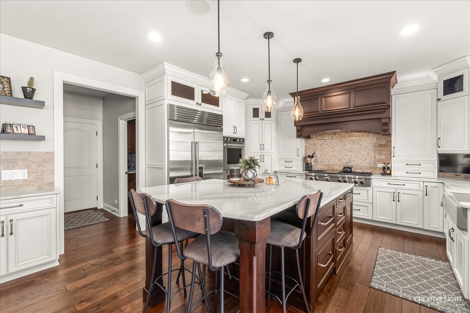 3680 Broadleaf Avenue Elgin, IL 60124 - Photo 11 of 69 a kitchen with stainless steel appliances kitchen island granite countertop a table chairs sink and cabinets
