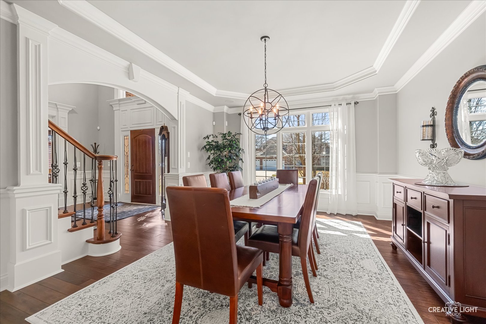 3680 Broadleaf Avenue Elgin, IL 60124 - Photo 15 of 69 a dining room with furniture a chandelier and wooden floor