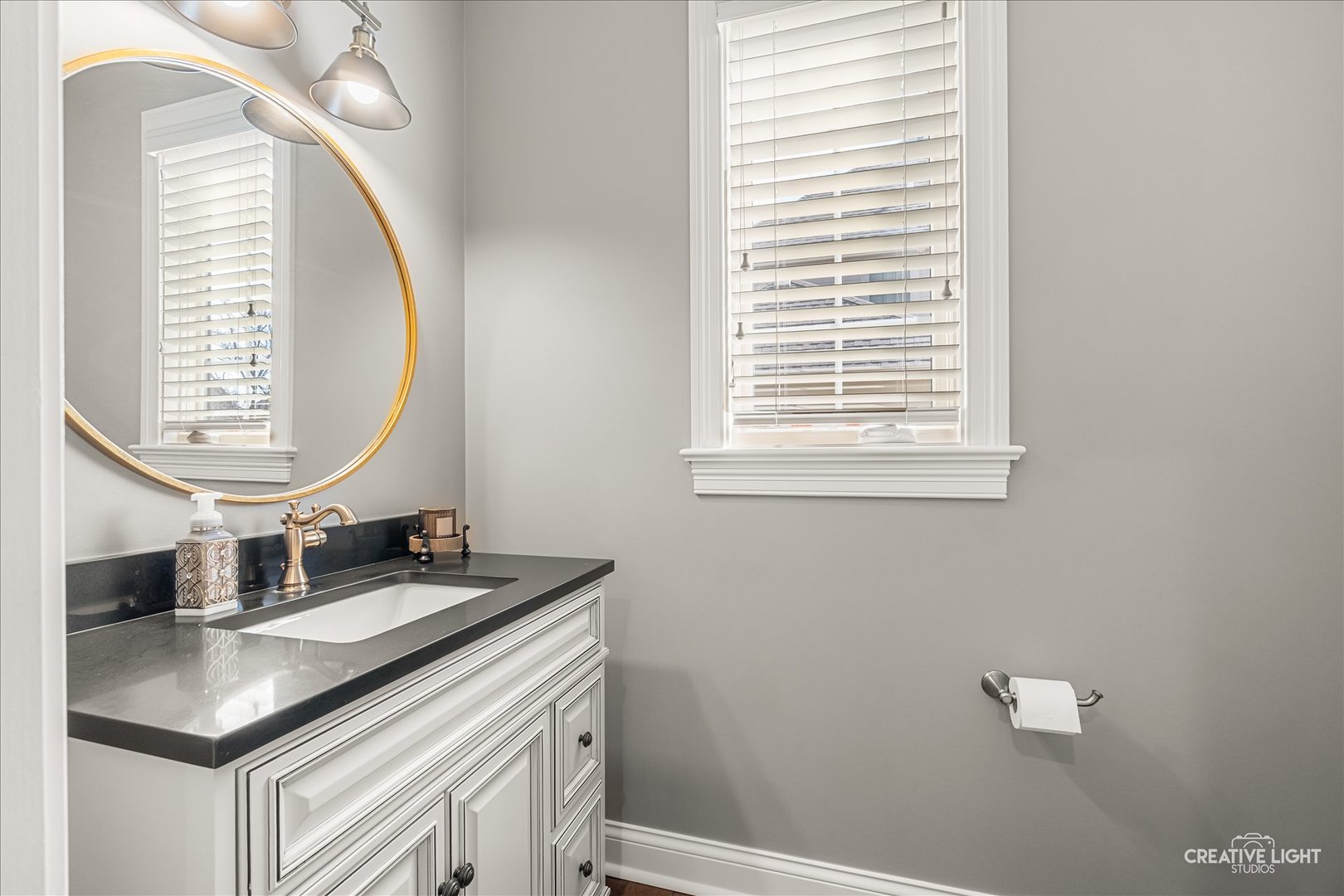 3680 Broadleaf Avenue Elgin, IL 60124 - Photo 18 of 69 a bathroom with a sink a vanity and a mirror