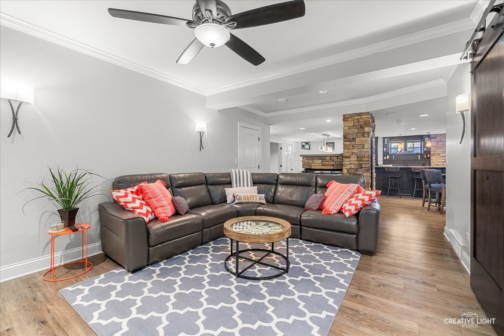 3680 Broadleaf Avenue Elgin, IL 60124 - Photo 36 of 69 a living room with furniture a rug and a chandelier