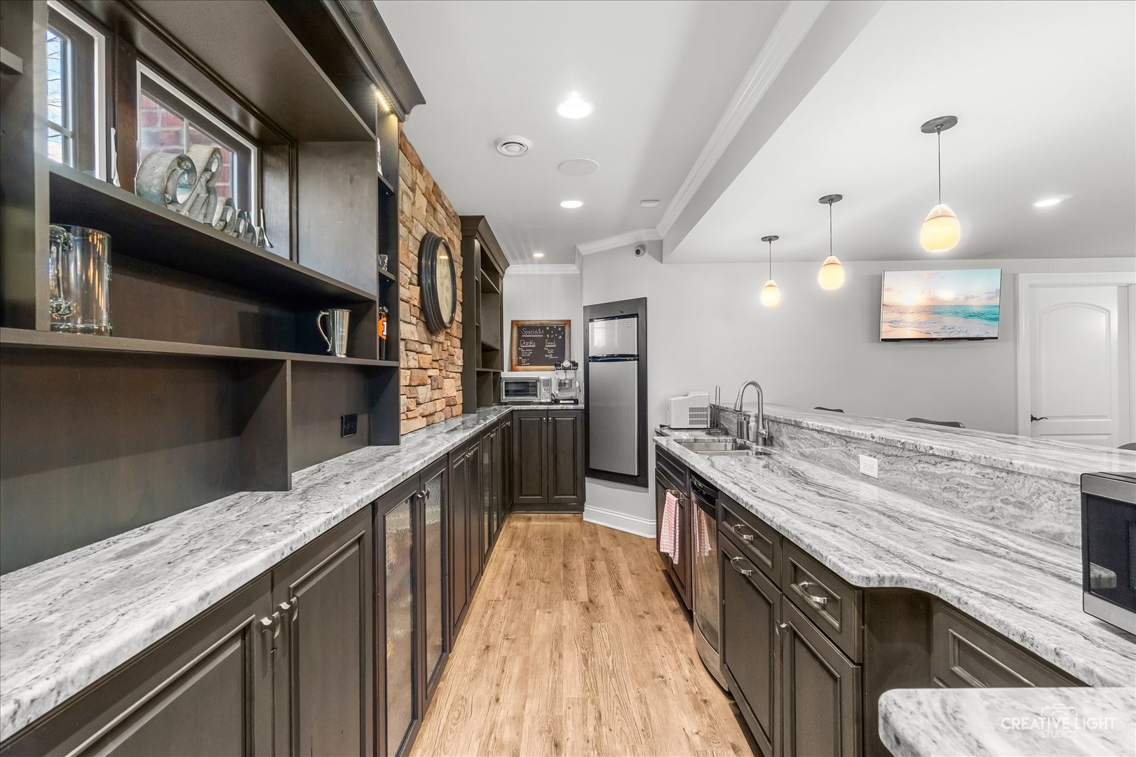 3680 Broadleaf Avenue Elgin, IL 60124 - Photo 42 of 69 a kitchen with stainless steel appliances granite countertop lots of counter space wooden floor and staircase