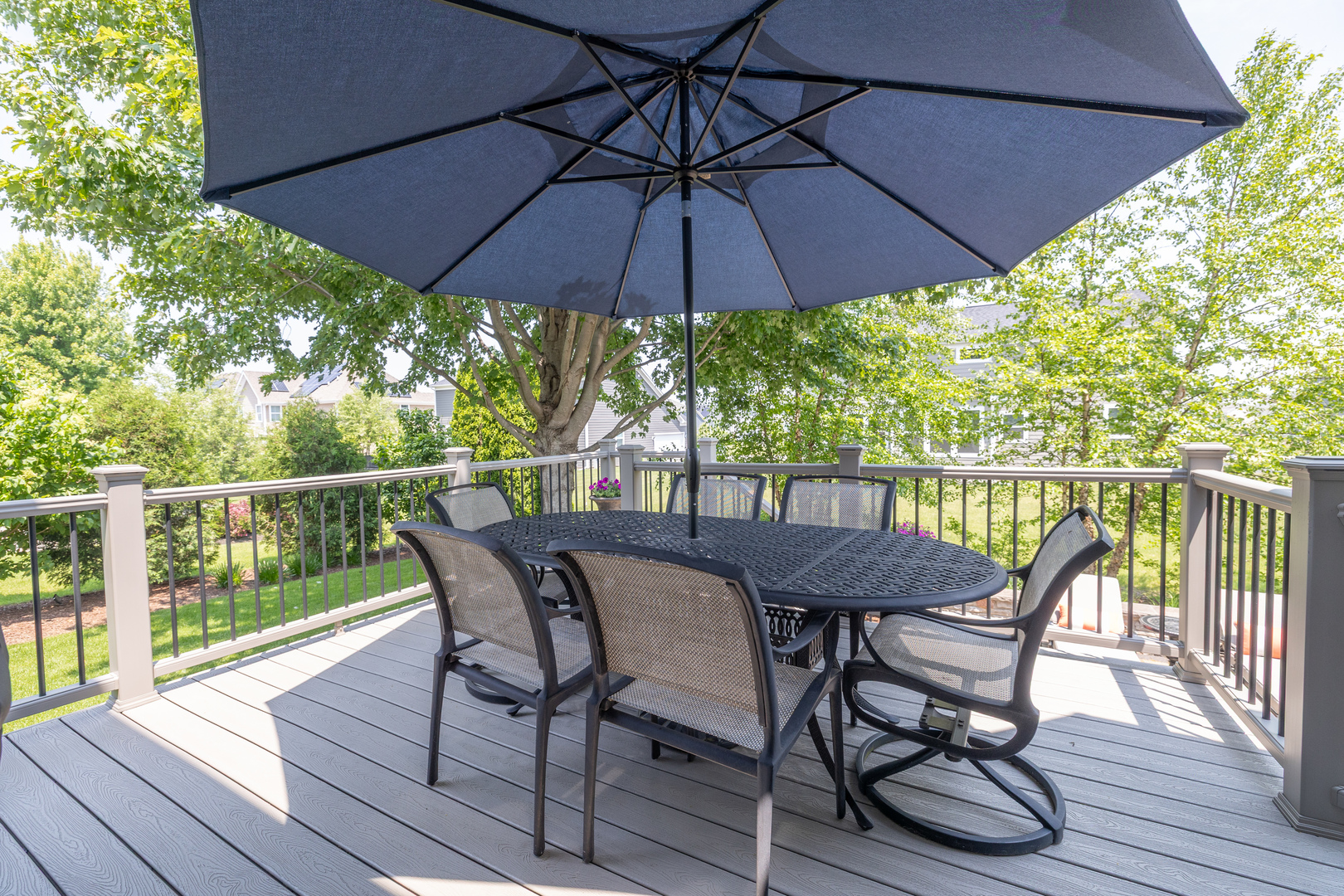 3680 Broadleaf Avenue Elgin, IL 60124 - Photo 52 of 69 a patio with wooden floor a yard a table and chairs