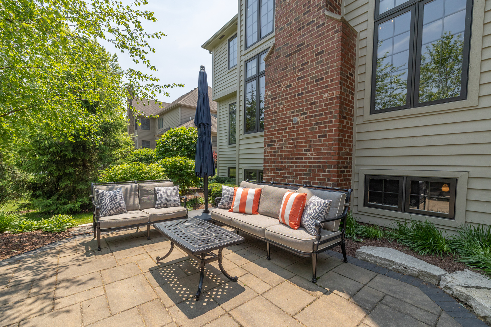3680 Broadleaf Avenue Elgin, IL 60124 - Photo 57 of 69 a view of a patio with couches and a fire pit and a fire pit