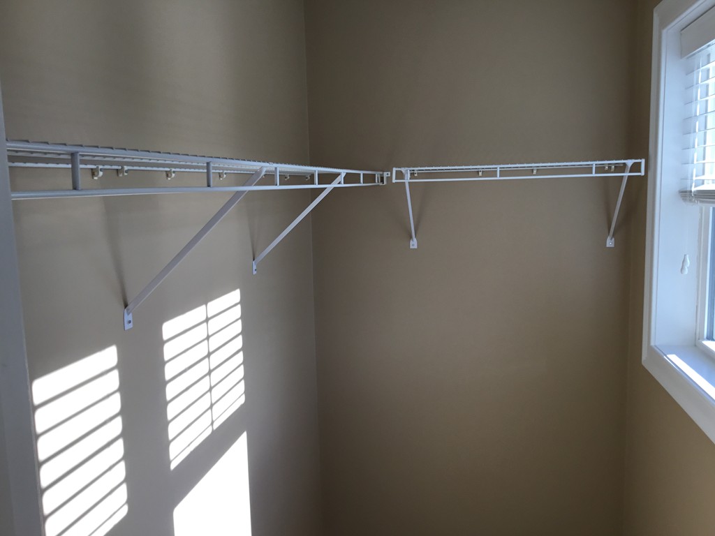 85 B Maple Avenue, Unit B Rutland, MA 01543 - Photo 11 of 19 a view of a room with racks on the wall and a window