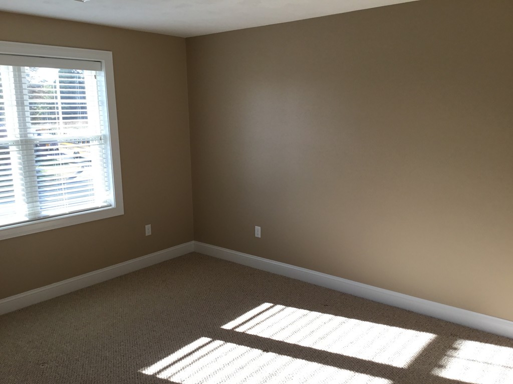 85 B Maple Avenue, Unit B Rutland, MA 01543 - Photo 12 of 19 a view of an empty room and a window