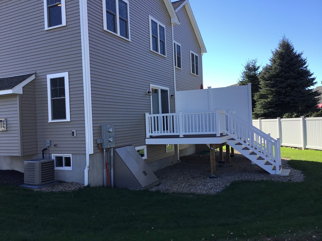 85 B Maple Avenue, Unit B Rutland, MA 01543 - Photo 2 of 19 a view of a house with backyard and sitting area