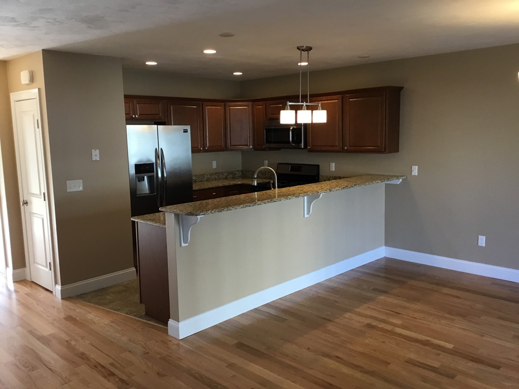85 B Maple Avenue, Unit B Rutland, MA 01543 - Photo 3 of 19 a kitchen with stainless steel appliances a refrigerator and a sink