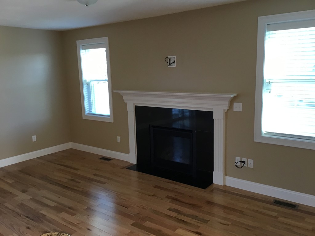 85 B Maple Avenue, Unit B Rutland, MA 01543 - Photo 6 of 19 a view of an empty room with wooden floor and a window