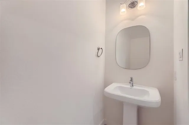 a open kitchen with white cabinets and stainless steel appliances