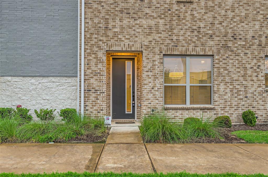 401 Division Street Plano, TX 75075 - Photo 4 of 28 a front view of a brick house with a yard